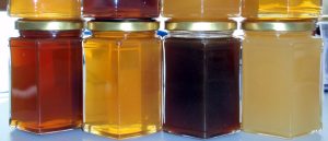 Desiccant methods through dehumidifiers and other systems for honey preservation